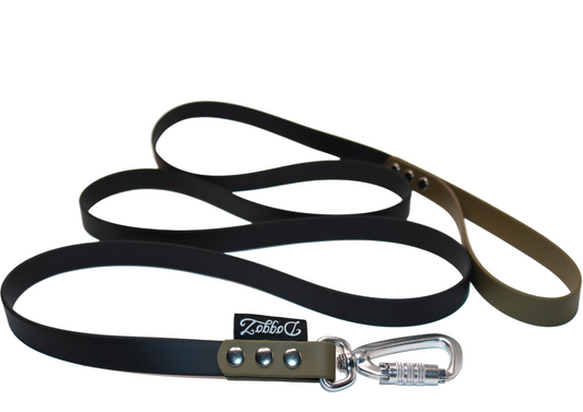 A black BioThane dog leash with an olive green handle and connector, featuring a silver locking carabiner, heavy-duty silver rivets, and the DoggoZ brand label.
