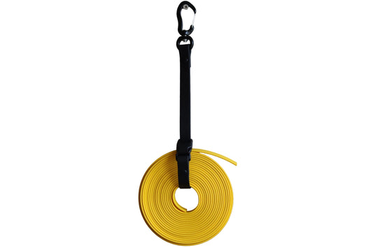 A black BioThane Long Line Keeper from DoggoZ securing a neatly coiled yellow long dog leash. The keeper includes a heavy-duty black carabiner for hanging and a quick-release buckle for easy access.